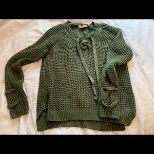 Green hockey lace knit sweater